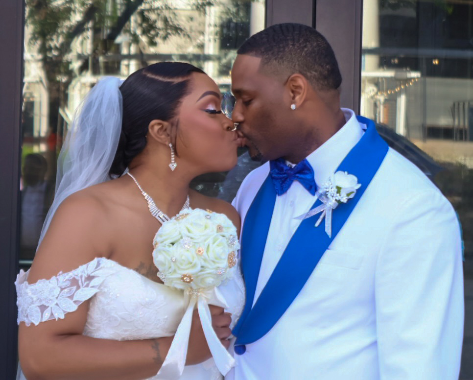 Bride and groom share a first kiss — KickzPov Media wedding photography